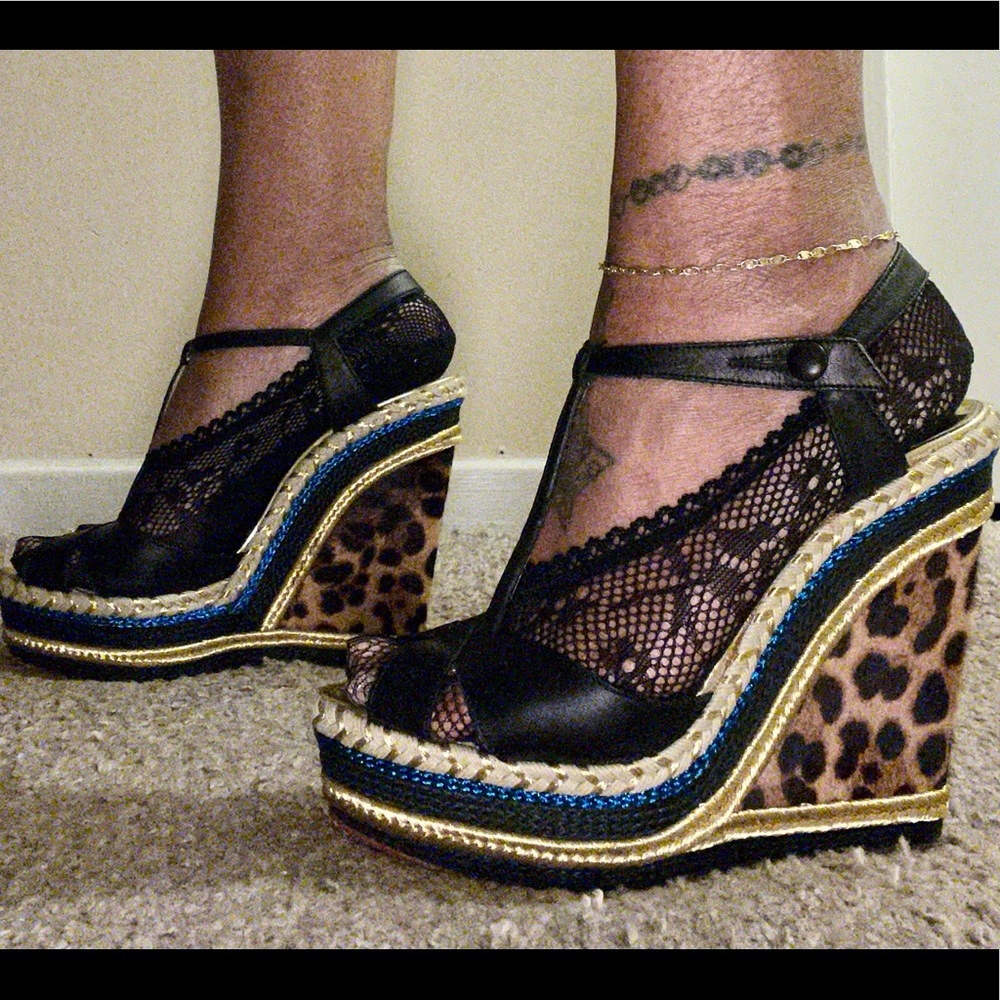 CHRISTIAN LOUBOUTIN
Black Leather and Leopard Calf Hair Trotolita